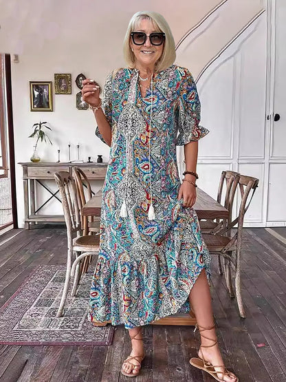 Robe tunique longue style bohème à imprimé cachemire et col noué avec pompons - Style vacances élégant avec cordon de serrage, ourlet à volants et imprimé aléatoire 